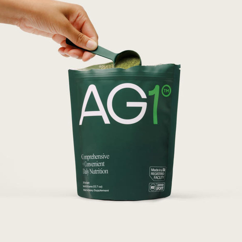 AG1 secure-cap packaging conveys travel-friendly daily supplement storage.