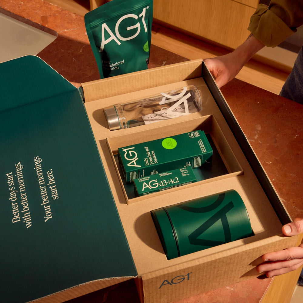 Hand holding bottle emphasizes convenient, customizable daily dose with one drop per serving.