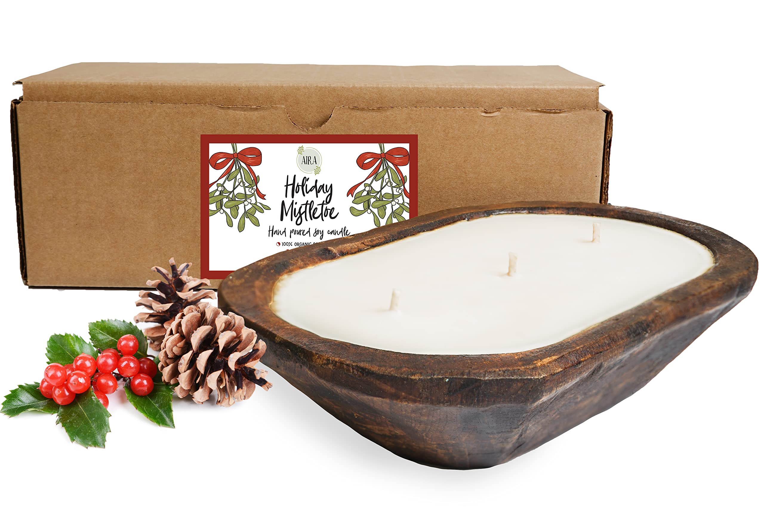 Aira Christmas Dough Bowl Candle in a wood bowl adds warm ambiance.