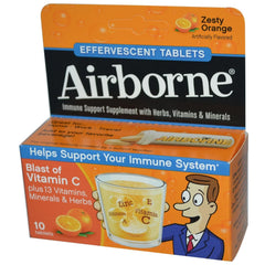 Airborne Zesty Orange effervescent tablet dissolving in water for daily vitamin C.