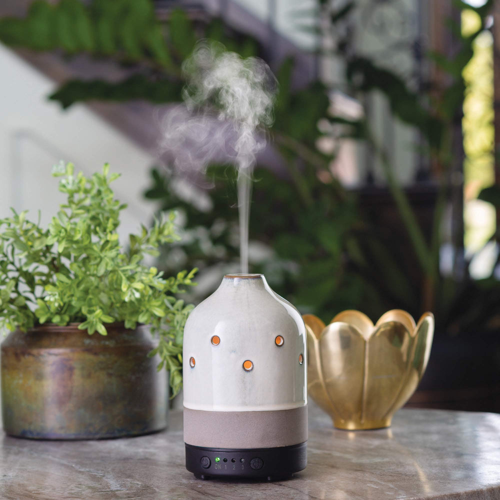 Airome ceramic diffuser side view highlighting compact form for easy placement.