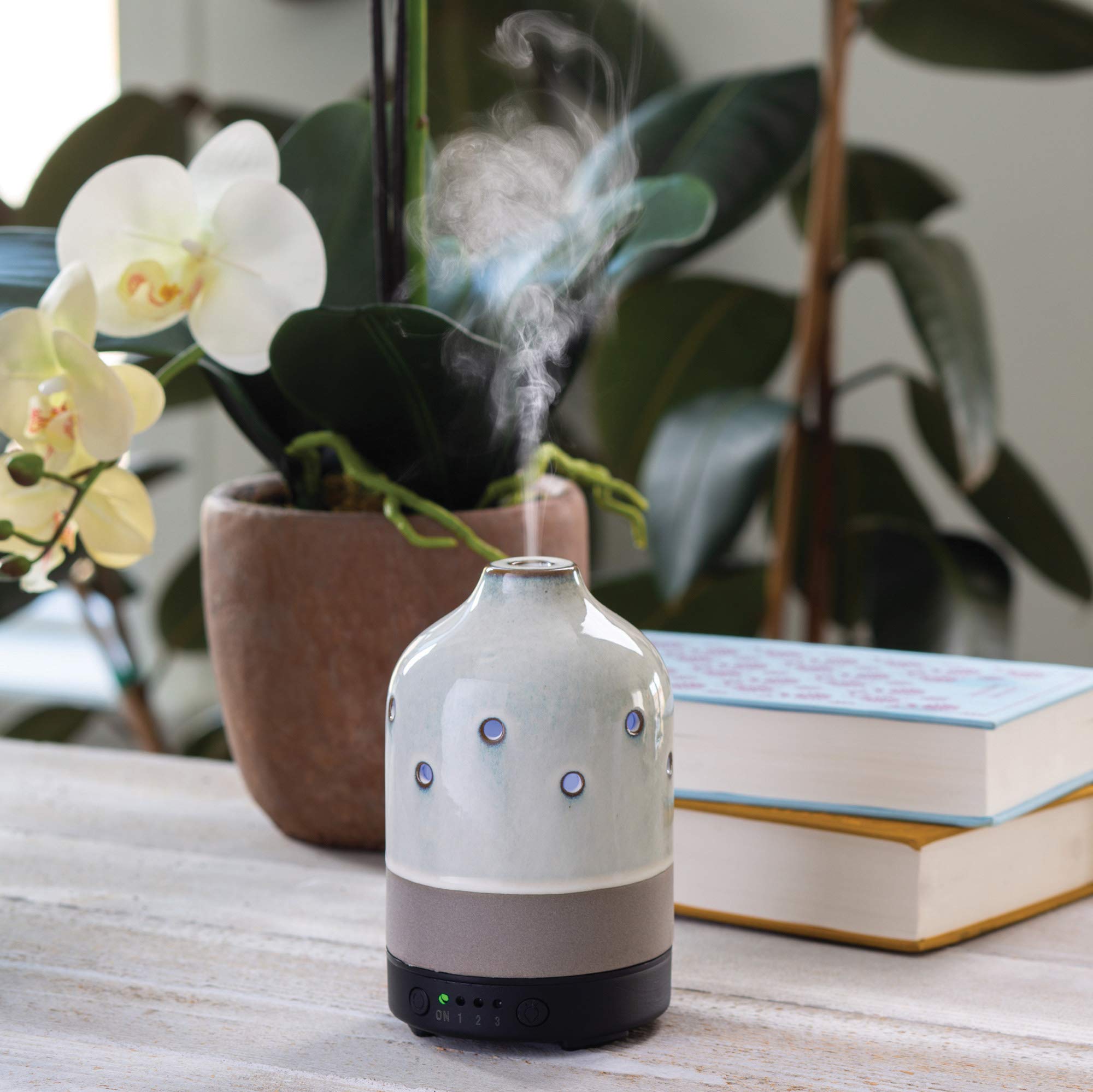 Airome diffuser showcasing 8 LED colors to set mood lighting.