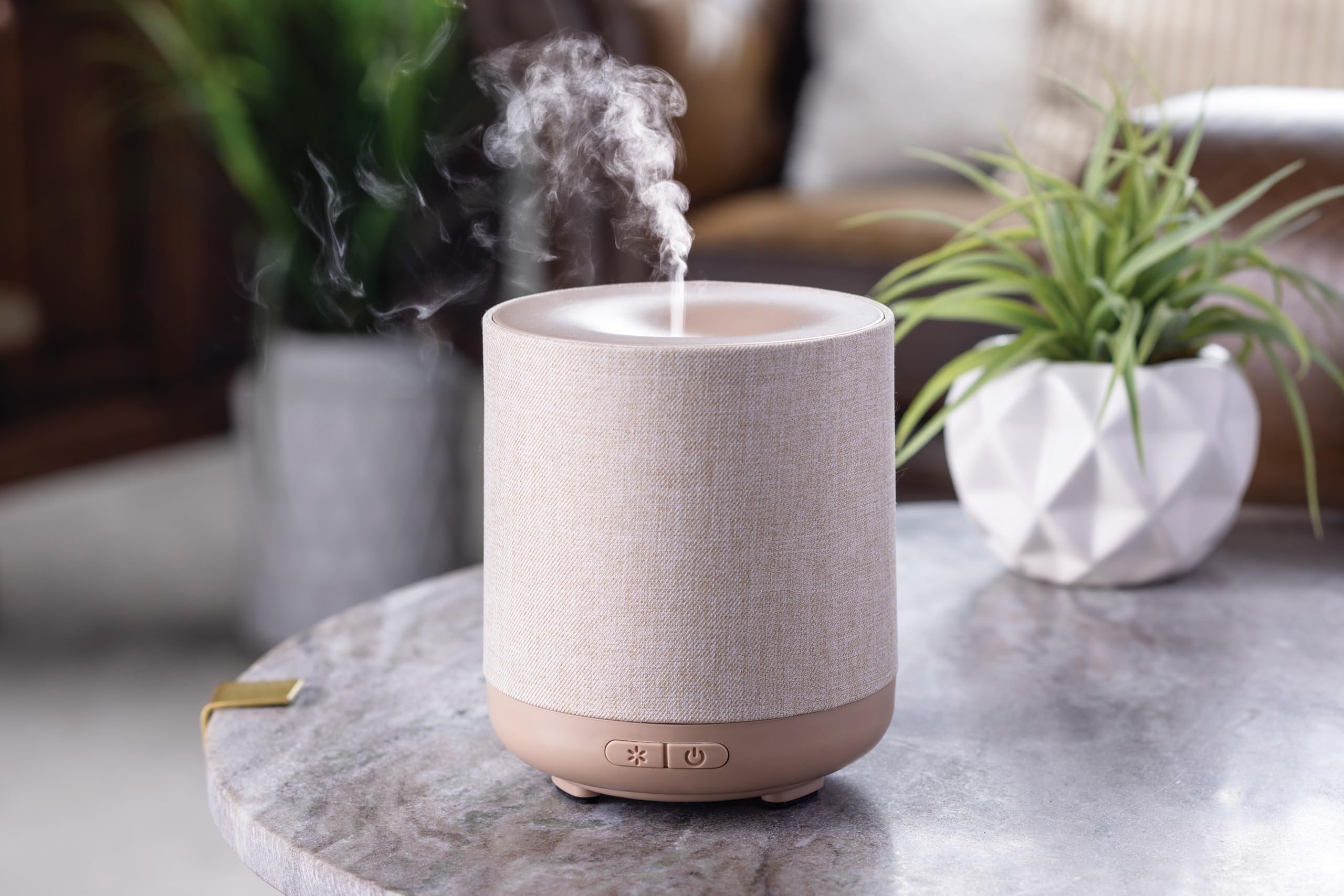 Airome Diffuser with 8-color LED lights creates ambient mood lighting.