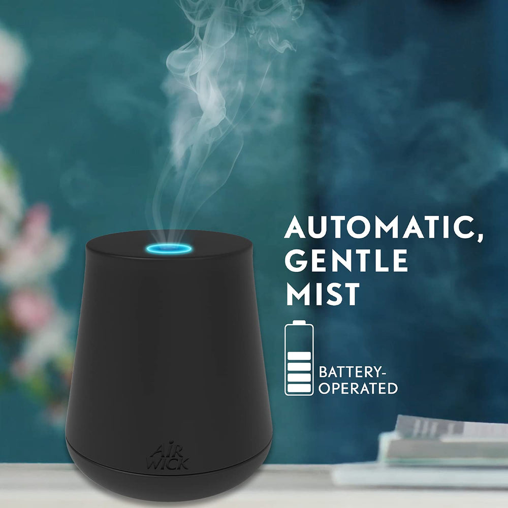 Air Wick Essential Mist Lemon Thyme refill displayed in a bright living room.