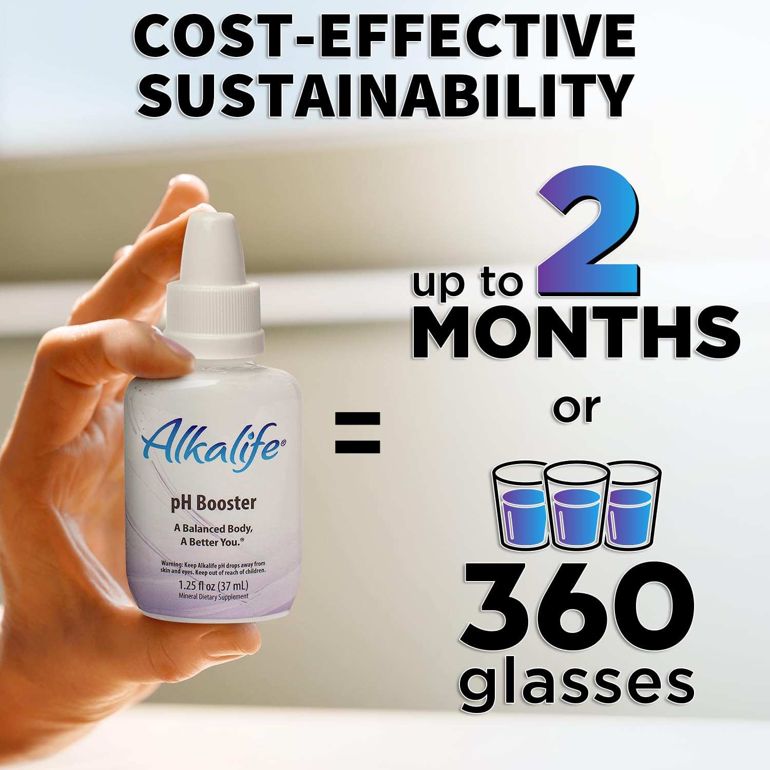 Glass of water with Alkalife pH Booster Drops mixed for alkaline hydration.