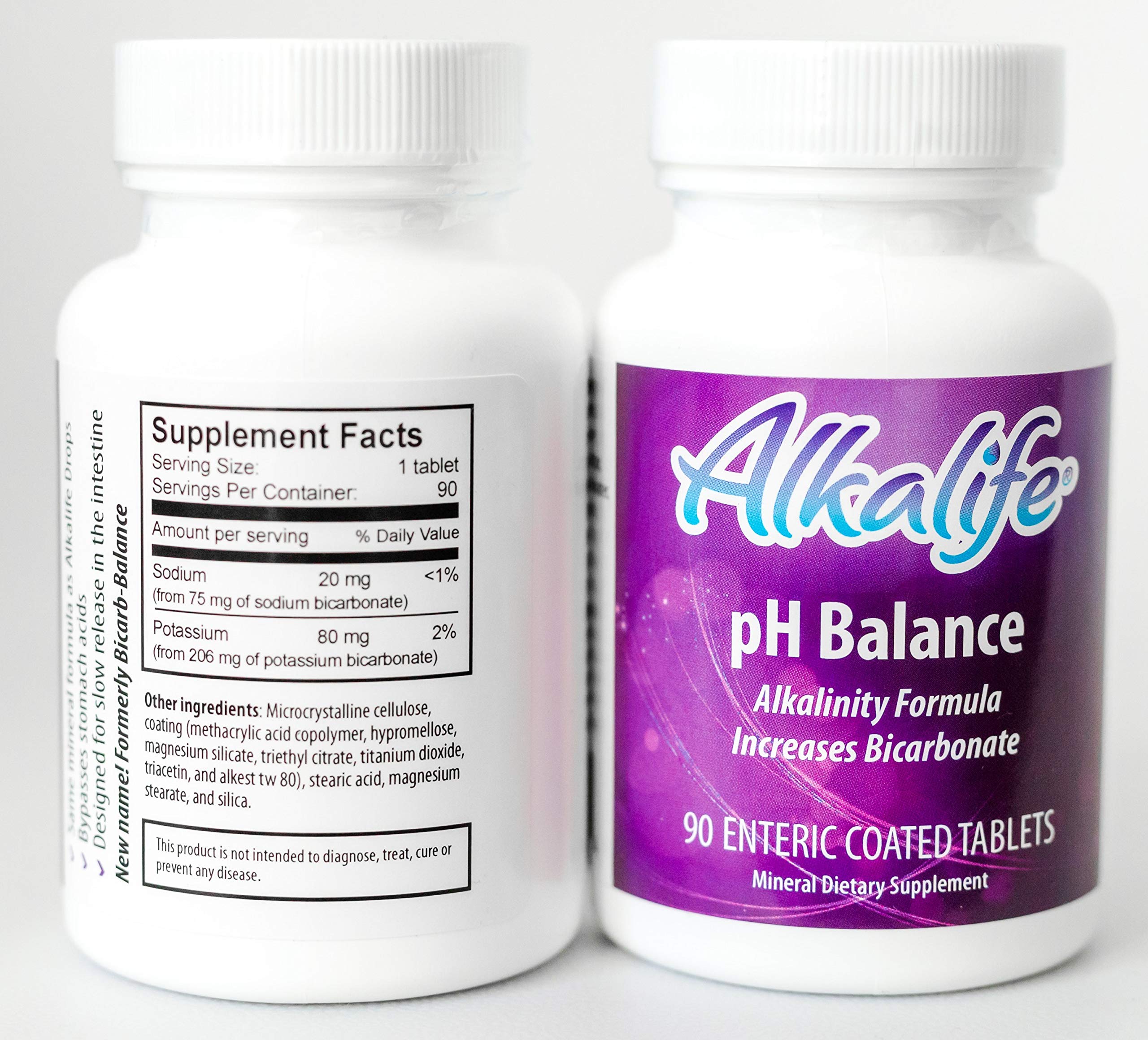 Alkalife pills held in hand, ready for daily use.