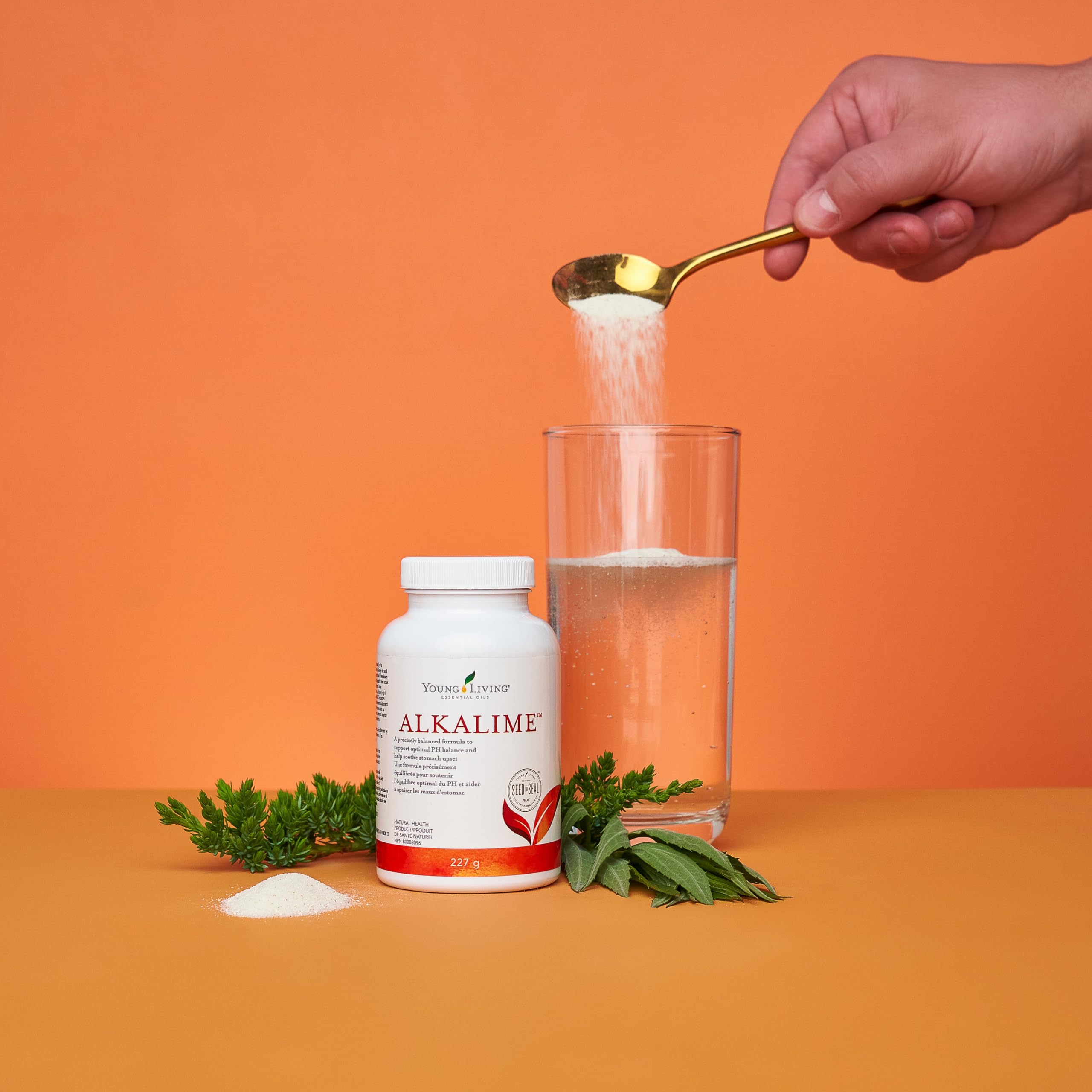 AlkaLime in a glass of water with lemon and lime for refreshing hydration.