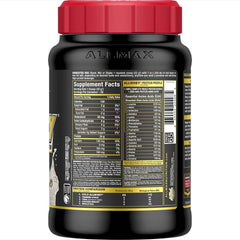AllMax Gold AllWhey scoop resting beside a glass for quick protein intake.
