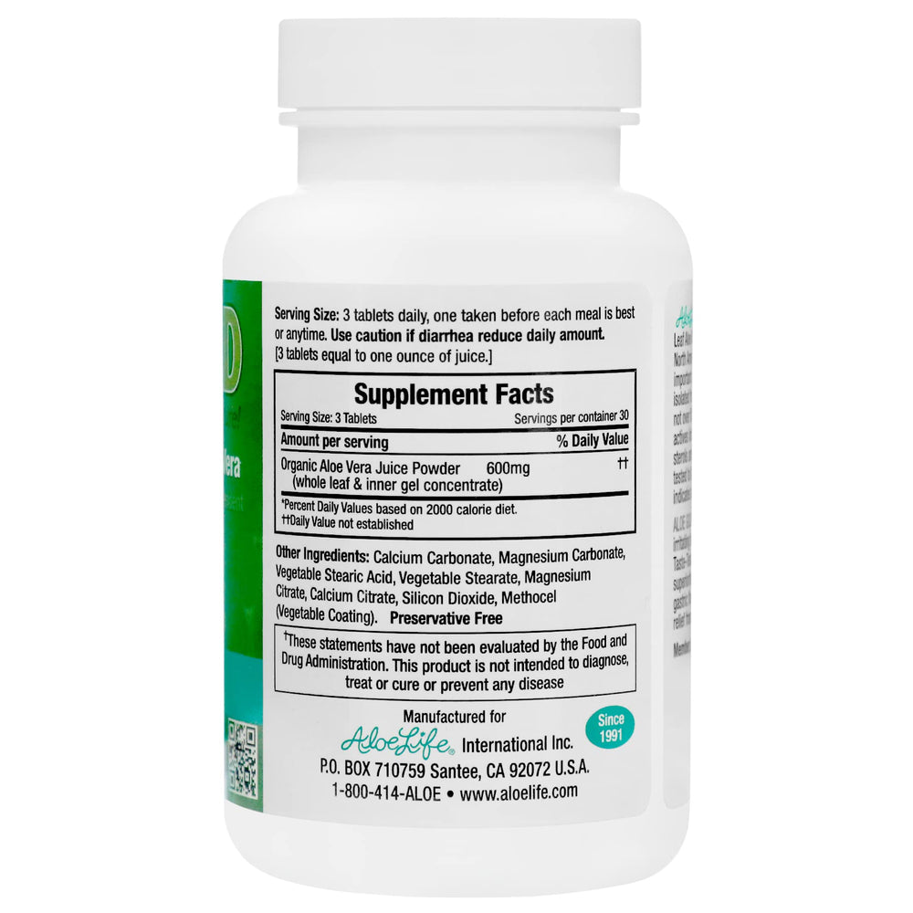 A close view of Aloe Life Aloe Gold tablets showing the herbal blend for digestion.