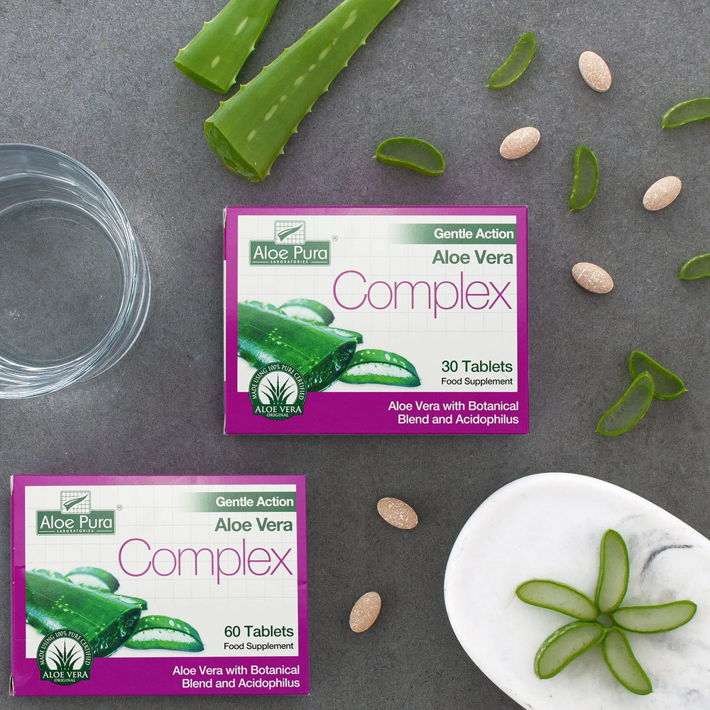 Aloe Pura Colax tablets in hand for daily routine.