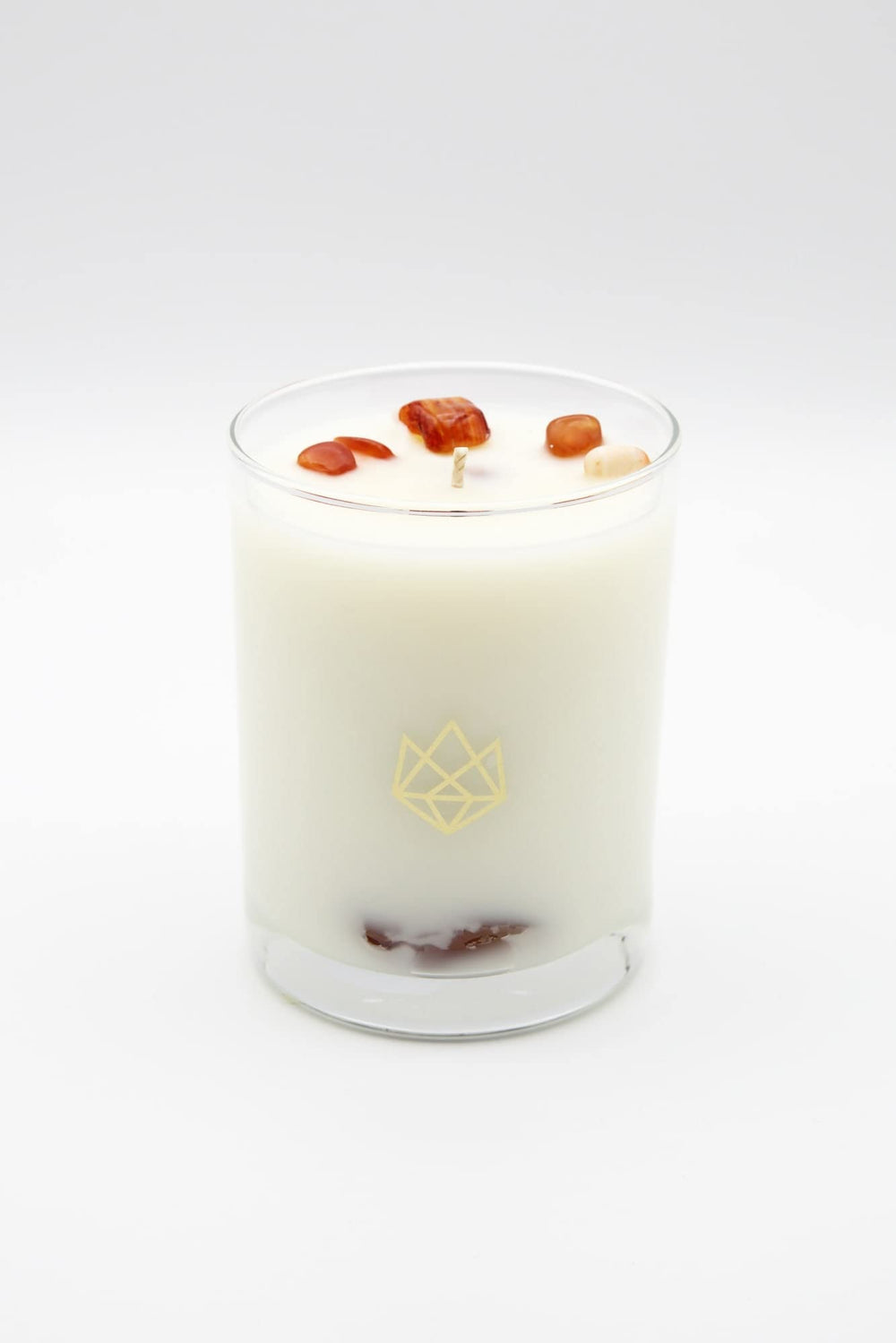 Aluminate Life red carnelian crystal-infused candle enhances courage and motivation vibes.