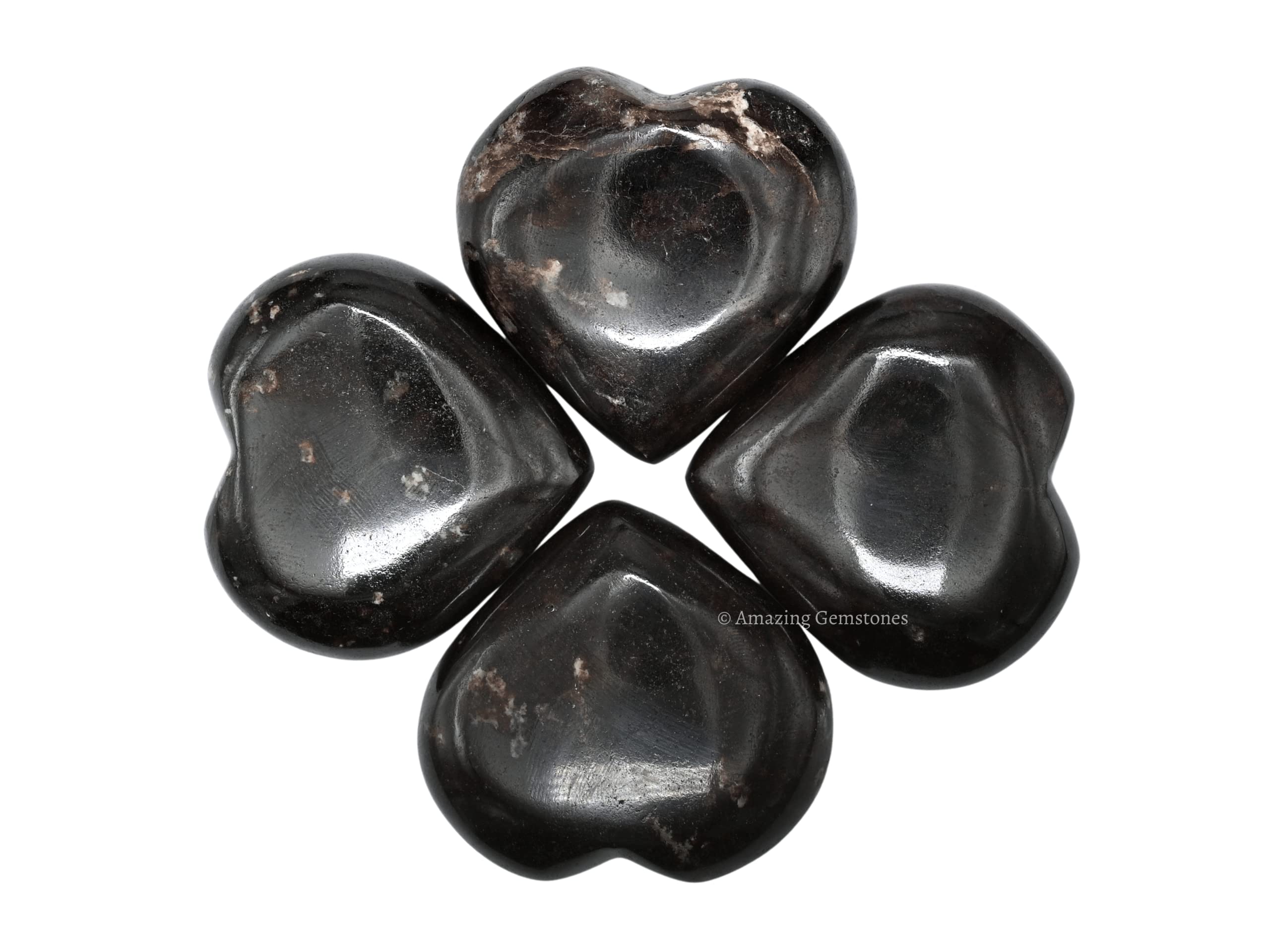 Amazing Gemstone Garnet heart palm stone enhances crystal grid setups for focus.