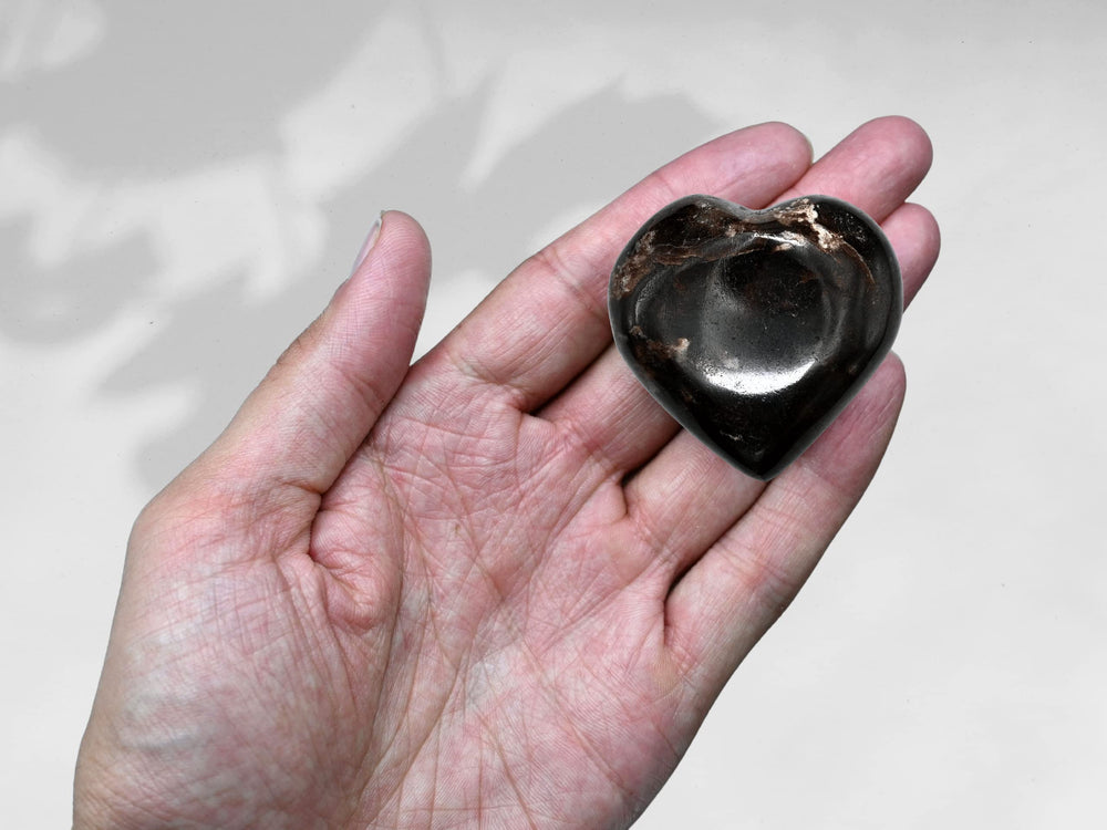 Amazing Gemstone Garnet heart palm stone assists Reiki practice in rituals.