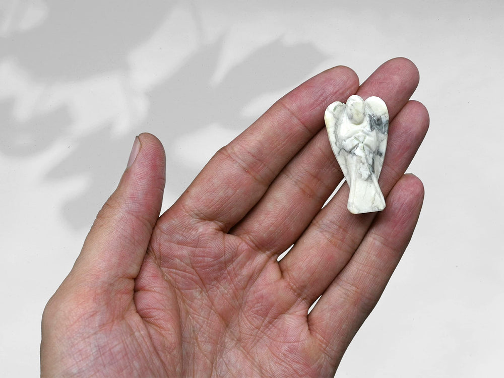 Amazing Gemstone Howlite Angel close-up with delicate facets and calming appeal.