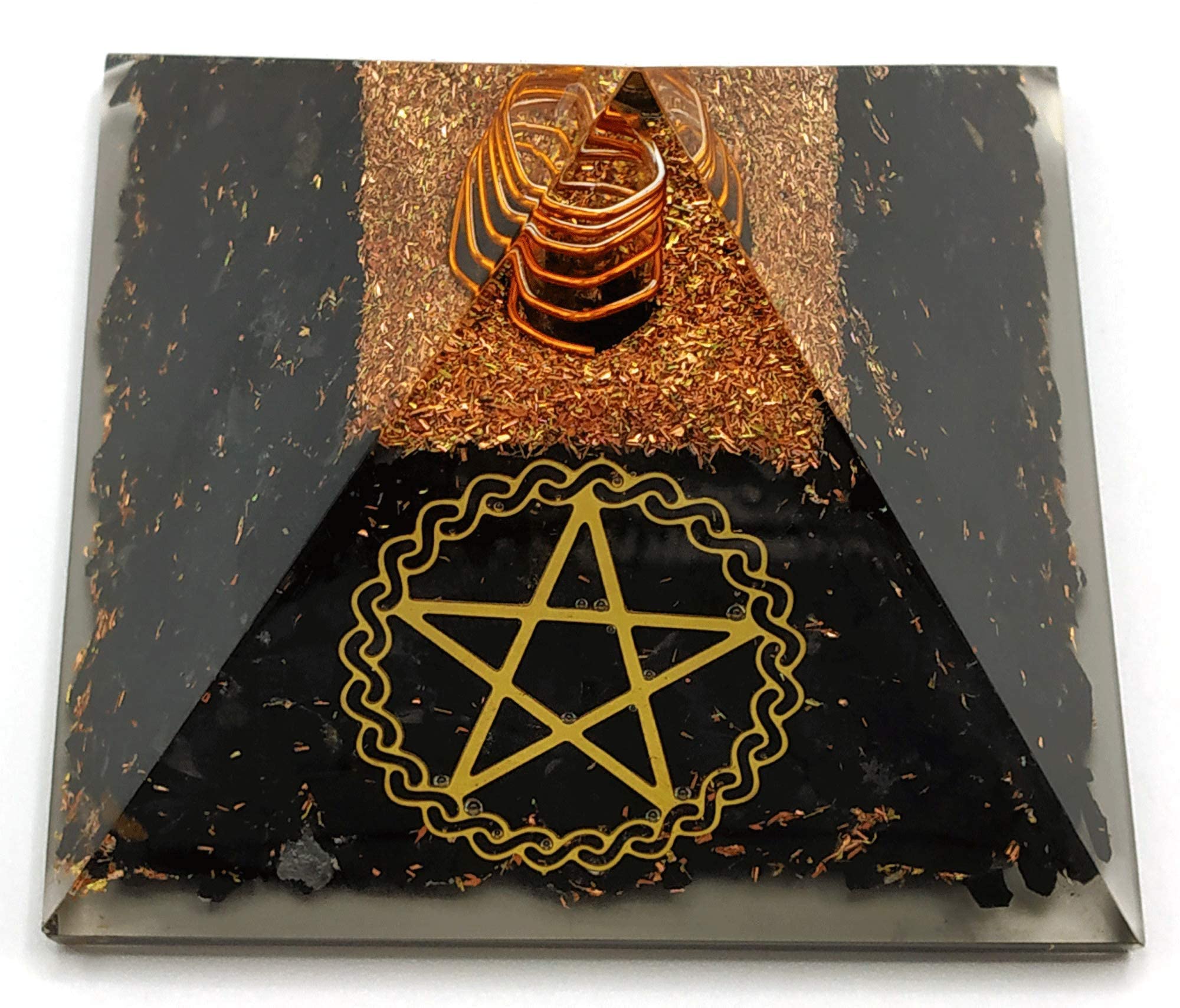 Amazing Gemstone Large Orgone Pyramid glossy finish reflects light in a room.