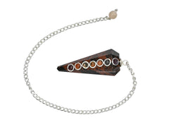 Amazing Gemstone chakra cabochon detail on pendulum inviting mindful dowsing