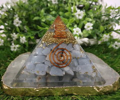 Amazing Gemstone orgone pyramid quartz point wrapped in copper coil for focused energy.