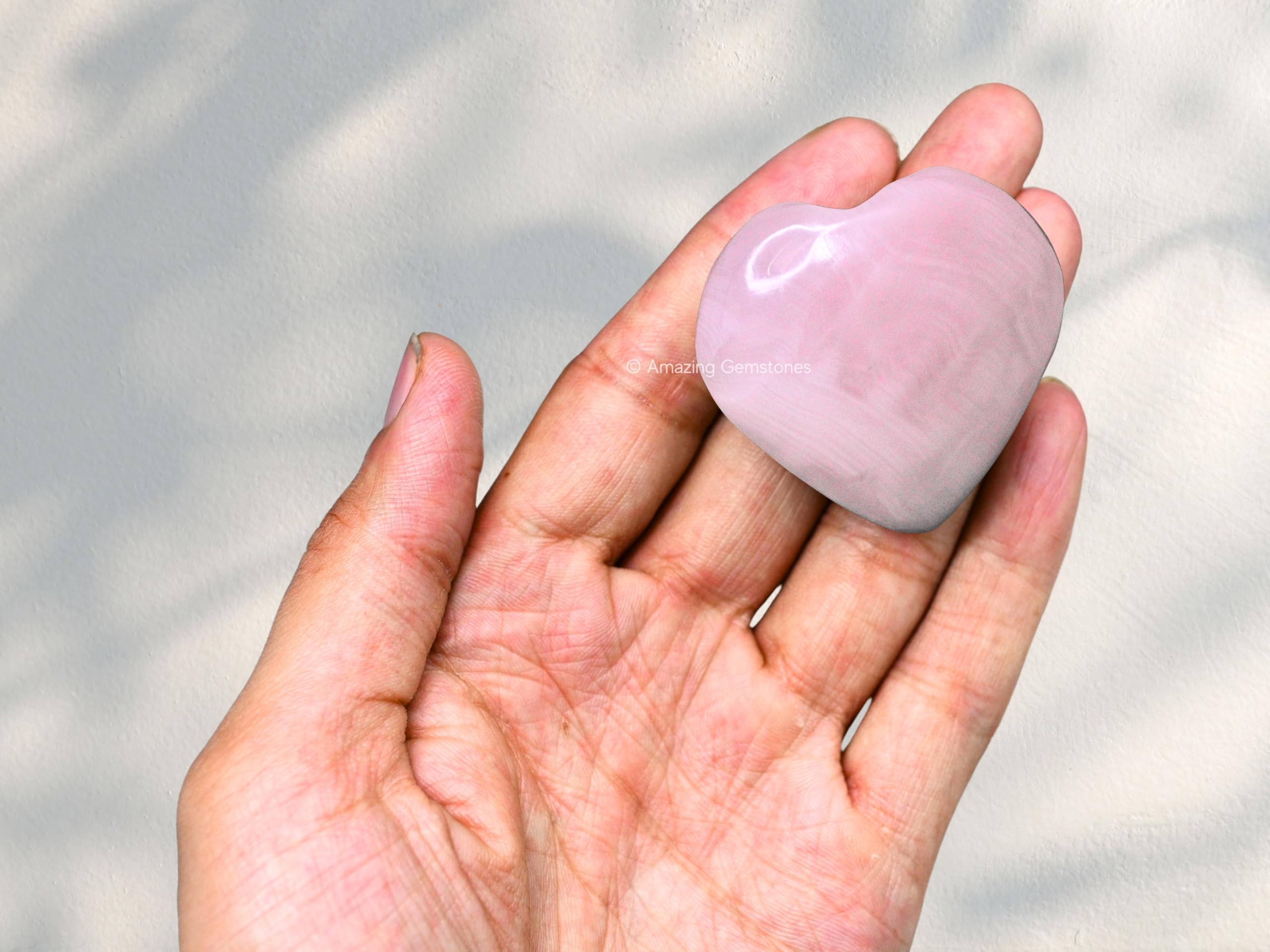 Amazing Gemstone Pink Calcite Heart Palm Stone spread for grid meditation.