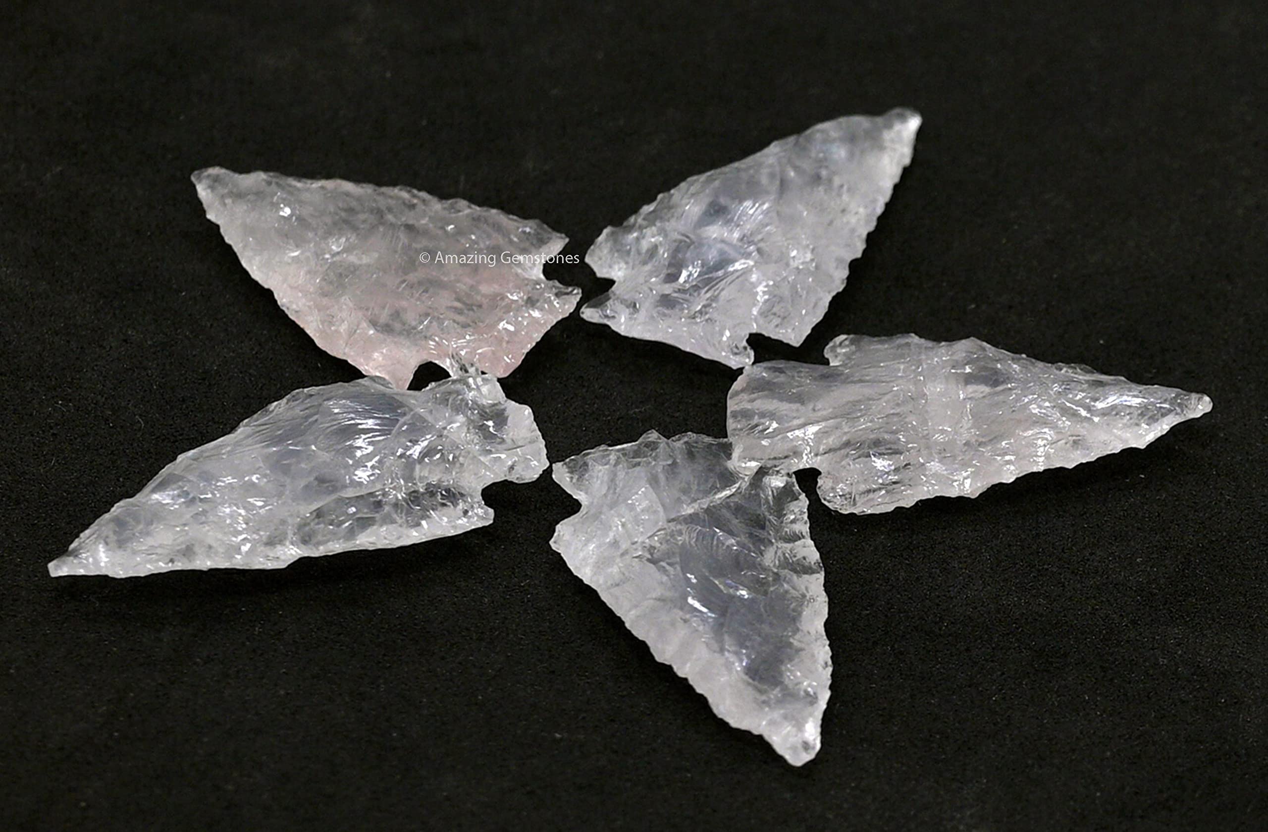 Amazing Gemstone rose quartz arrowhead display showcasing natural texture.