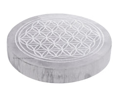 Amazing Gemstone selenite round disc on desk enhances crystal recharging and energy clarity
