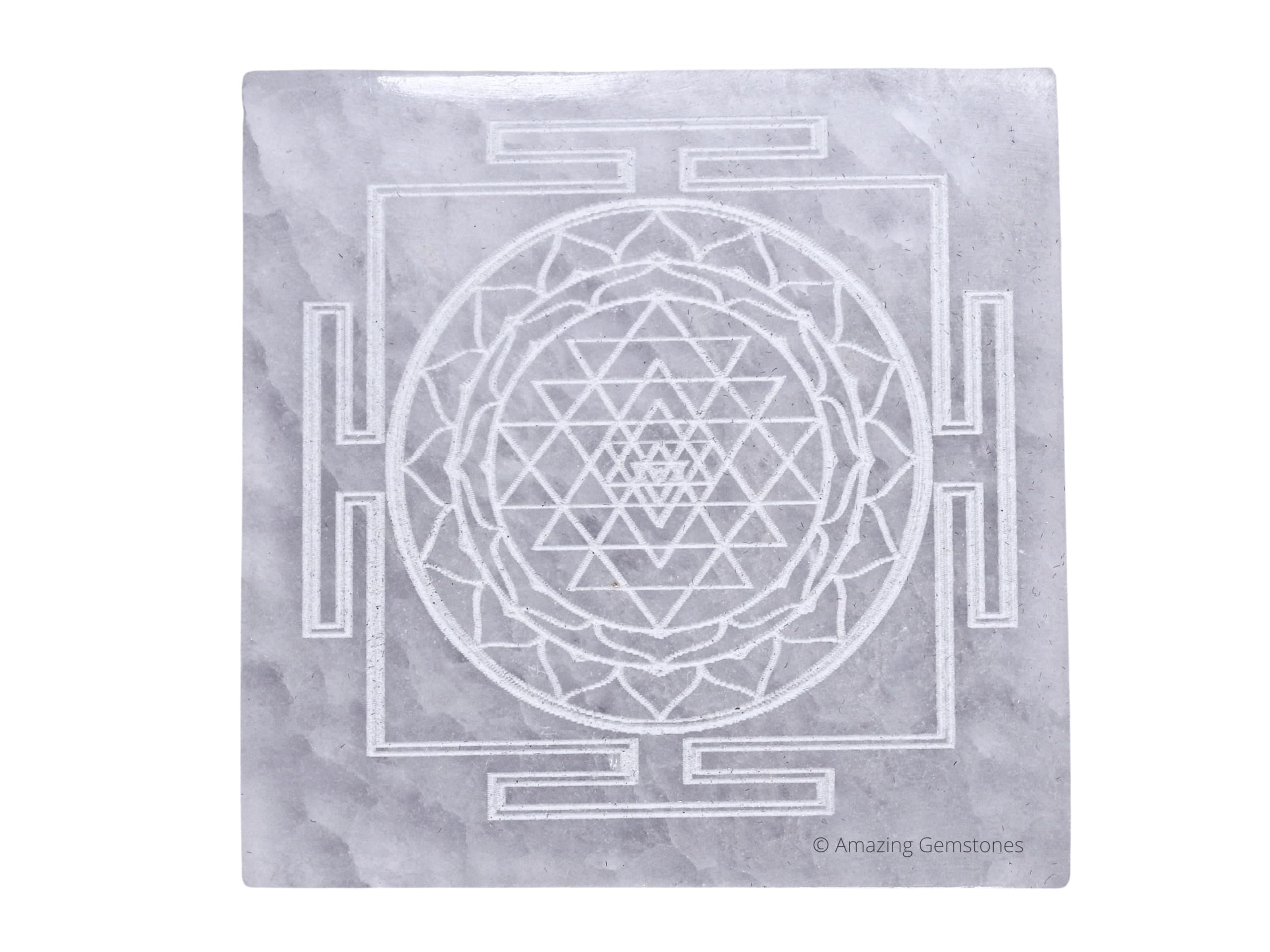 Amazing Gemstone selenite crystal charging plate with Shree Yantra engraving for crystal care on display