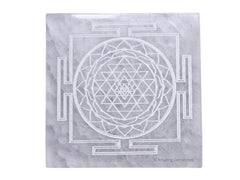 Amazing Gemstone selenite crystal charging plate with Shree Yantra engraving for crystal care on display