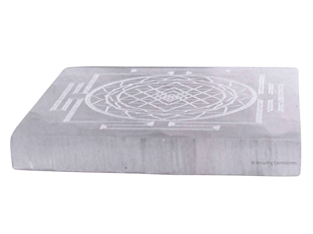Amazing Gemstone selenite charging plate on a desk supports crystal display