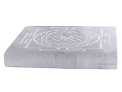 Amazing Gemstone selenite charging plate on a desk supports crystal display