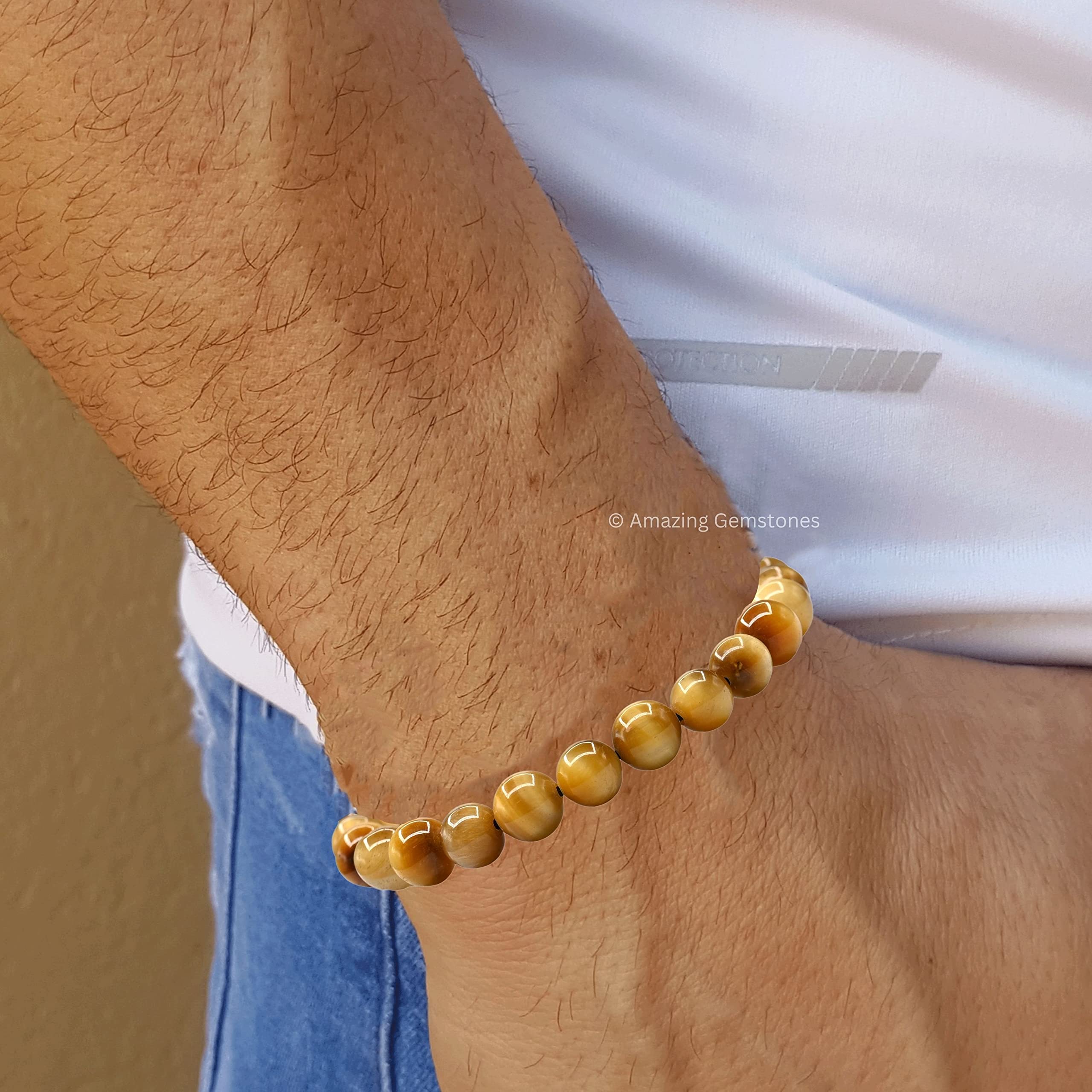 Amazing Gemstone Yellow Cat's Eye bracelet on wrist with adjustable fit for daily wear.