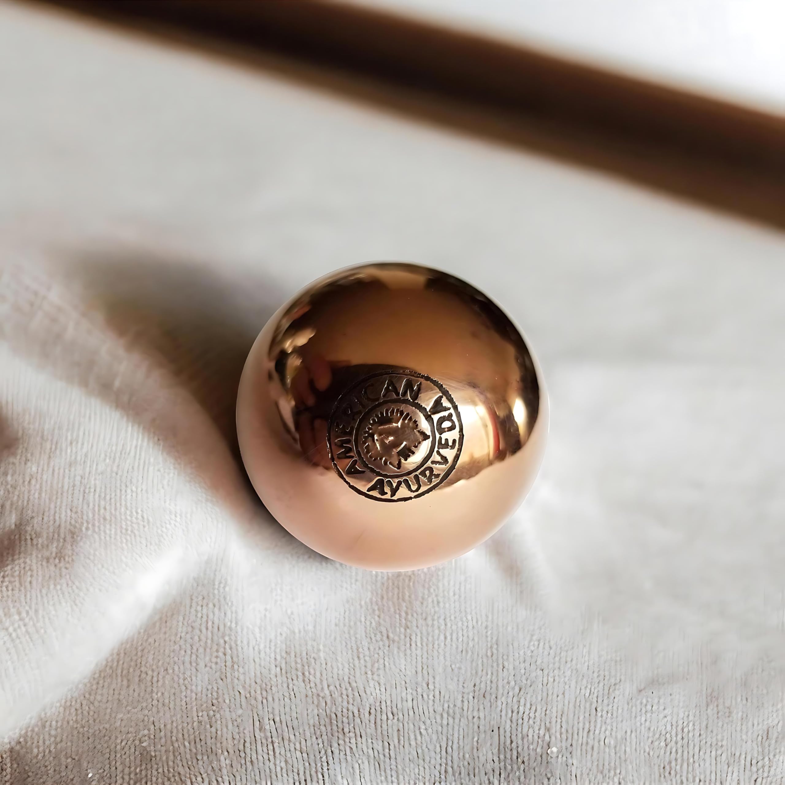 American Ayurveda copper ball during handheld meditation promotes grounding and focus