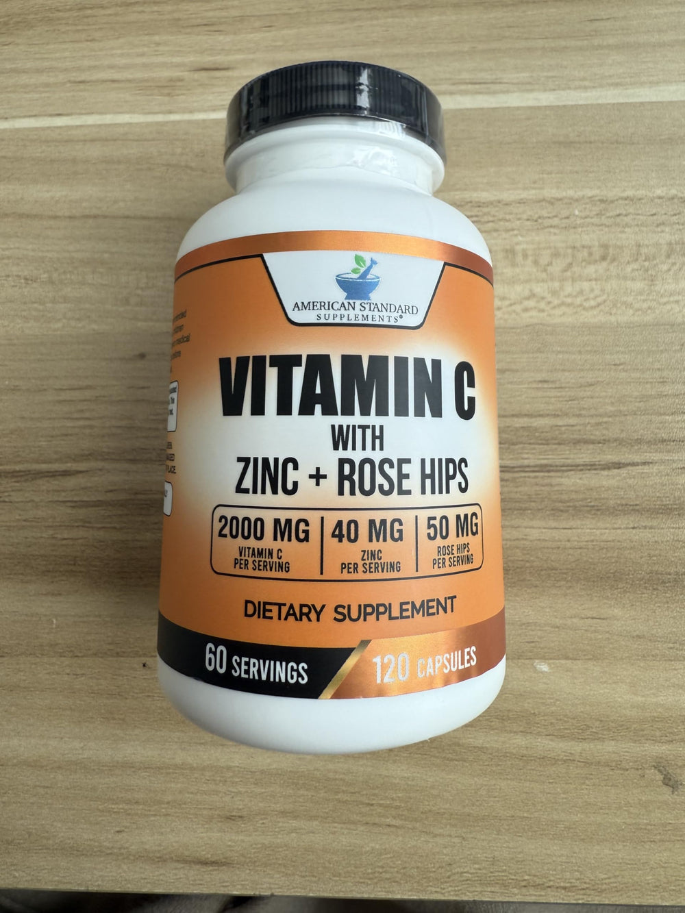 American Standard Supplements bottle displays vegan and non-GMO icons