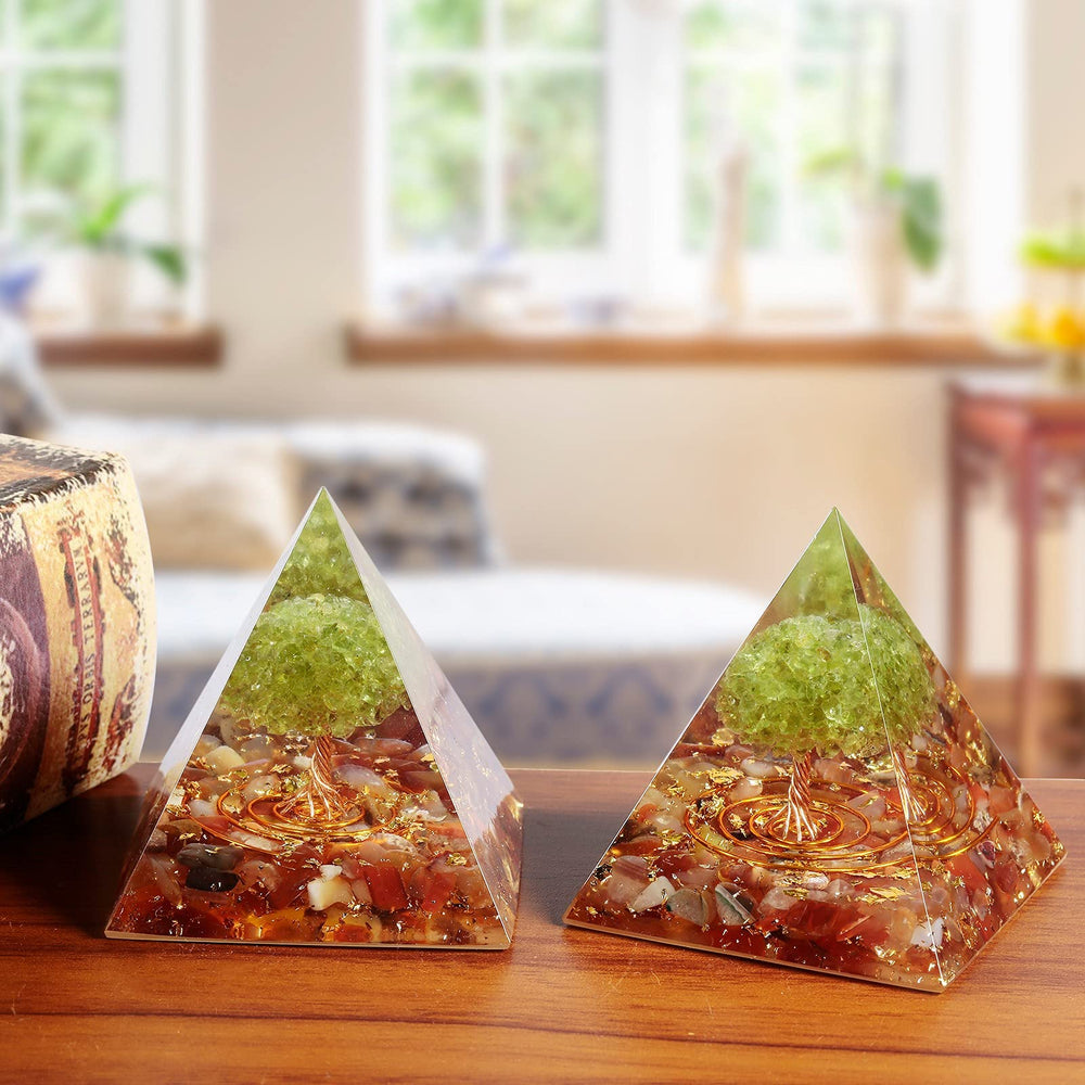 Amogeeli orgonite pyramid with gold powder accents adds decorative glow.