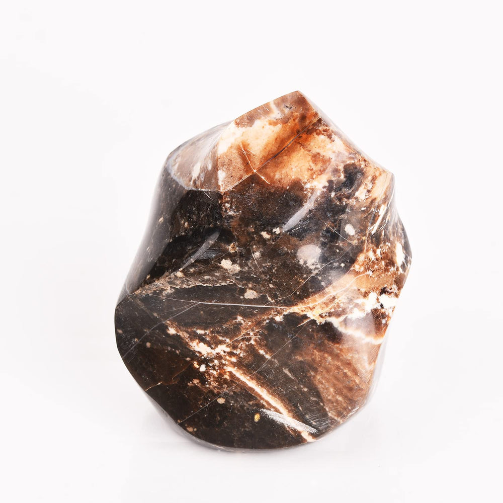 AMOYSTONE Black Opal Flame Tower placed on an altar for sacred practice visuals
