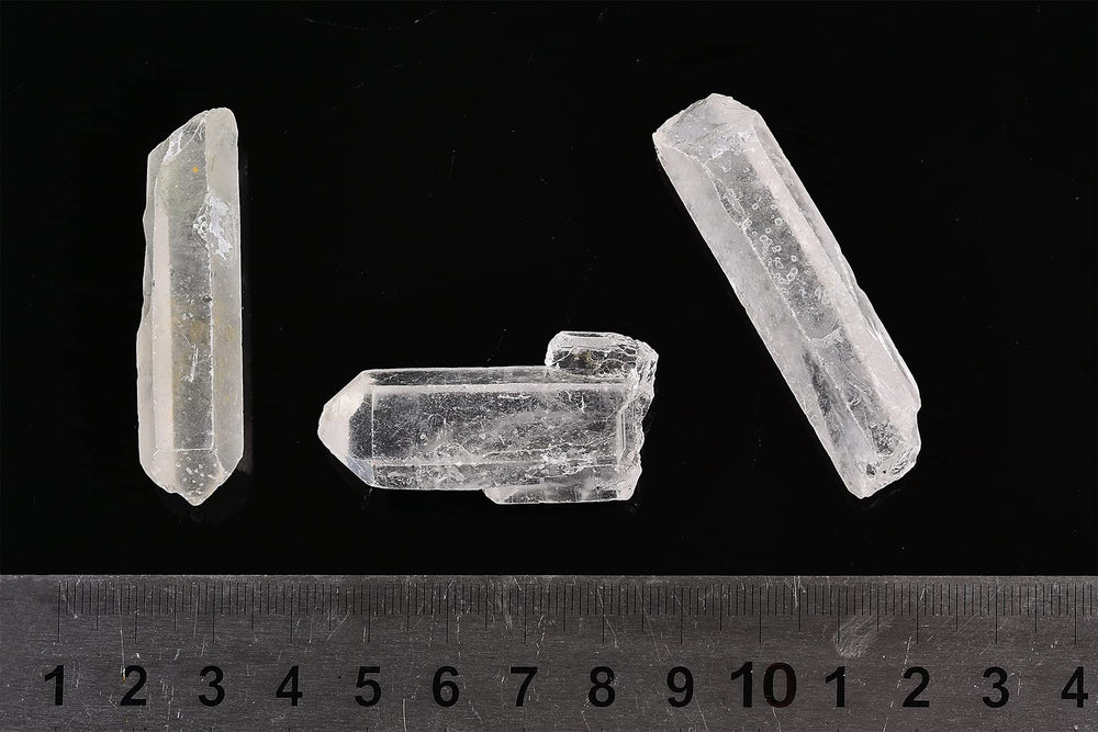 AMOYSTONE clear quartz points in box, ideal for decorative displays and calming ambience.