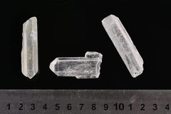 AMOYSTONE clear quartz points in box, ideal for decorative displays and calming ambience.