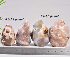 AMOYSTONE Flower Agate with rose inclusions adds gentle charm to shelves.