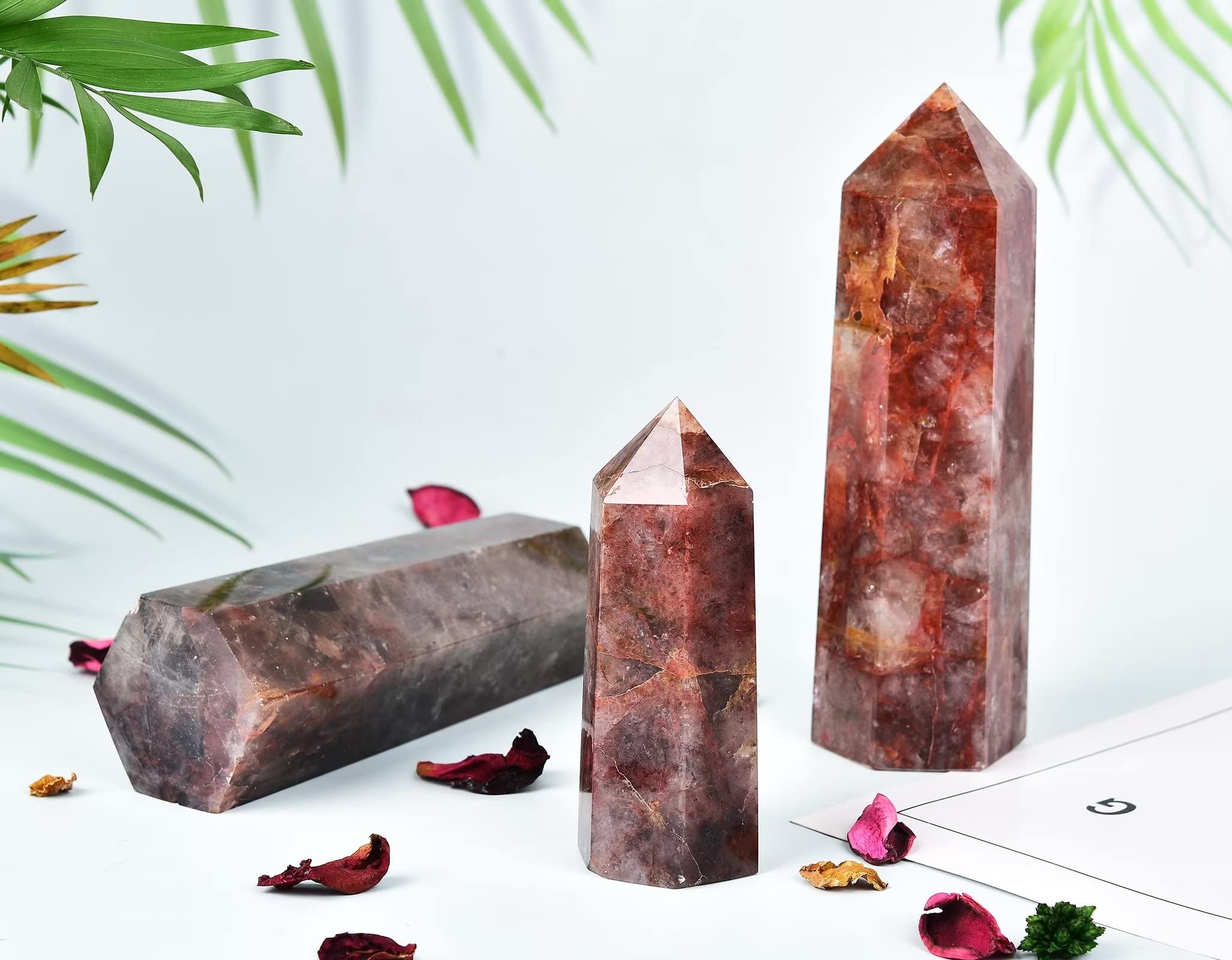 AMOYSTONE Hematoid Quartz wand on a shelf for home office decor.