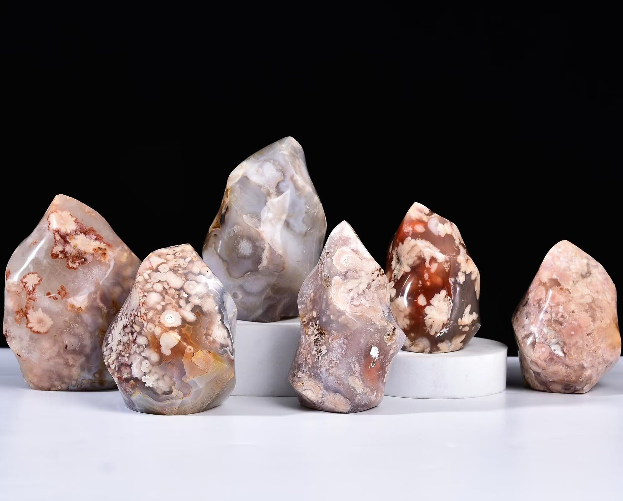 AMOYSTONE Cherry Blossom Agate flame tower enhances desk decor for calm work environment.