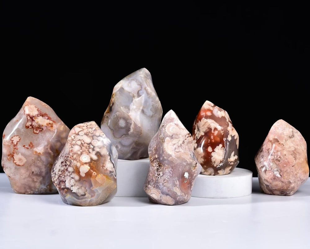 AMOYSTONE Cherry Blossom Agate flame tower enhances desk decor for calm work environment.