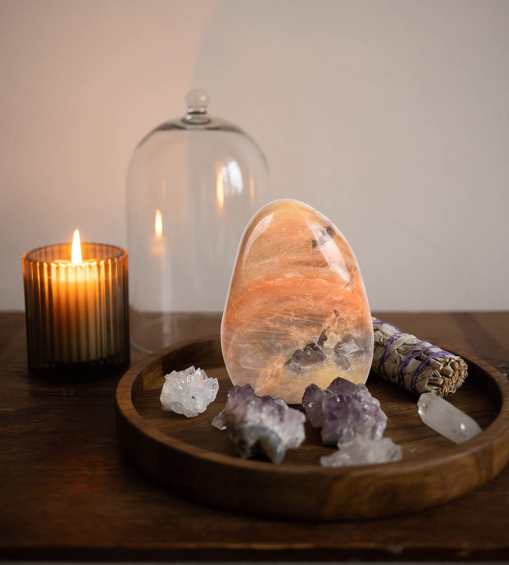 AMOYSTONE Orange Moonstone supports focus during yoga and energy work.