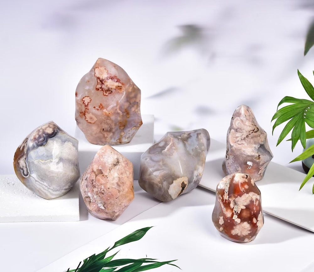 AMOYSTONE Pink flower inclusions create a visually soft, decorative crystal piece.