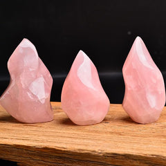 AMOYSTONE Rose Quartz Flame Tower, side angle, supports calm ambiance in living spaces.