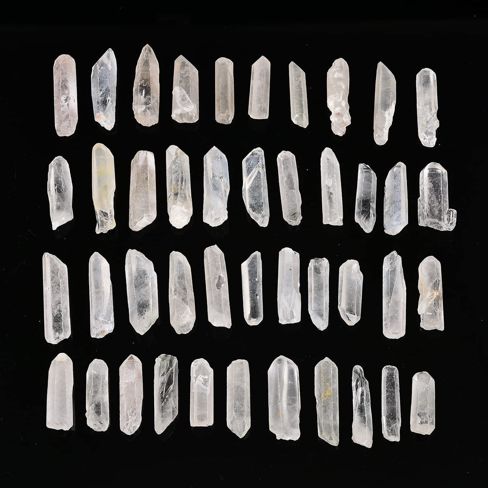 AMOYSTONE rough clear quartz points closeup, showcasing natural variety and organic textures.