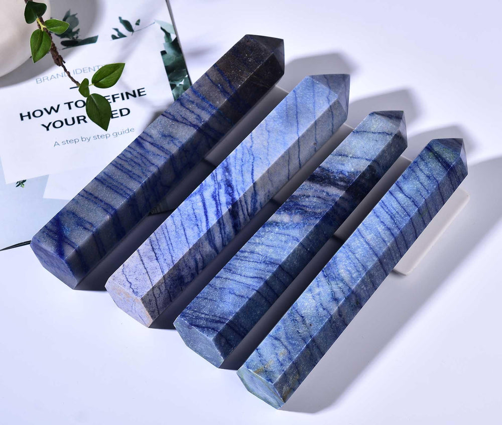 AMOYSTONE six-faceted wand in blue aventurine showing craftsmanship and sparkle.