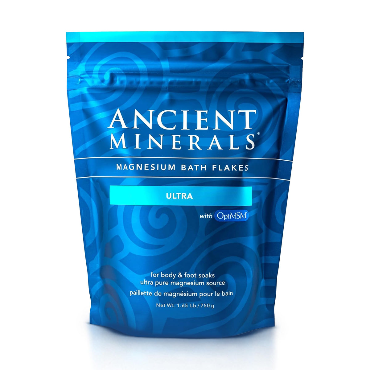 Ancient Minerals Magnesium Bath Flakes Ultra bottle being poured for a relaxing soak.