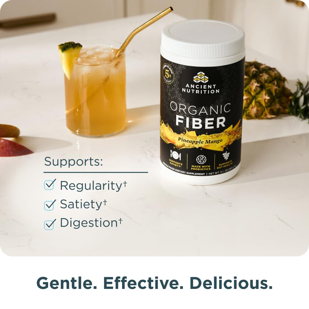 Ancient Nutrition Organic Fiber Powder glass dissolving into pineapple mango drink