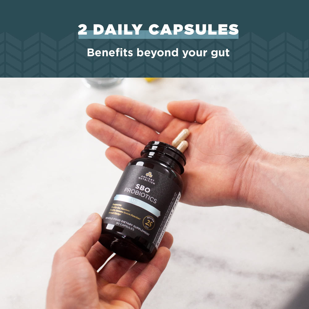 Capsules displayed on a surface to suggest daily digestive and immune support.