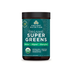 Ancient Nutrition Super Greens powder tub label visible, emphasizing organic greens blend for daily nutrition.