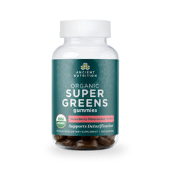 Ancient Nutrition Supergreens Gummy bottle on counter supports daily energy.