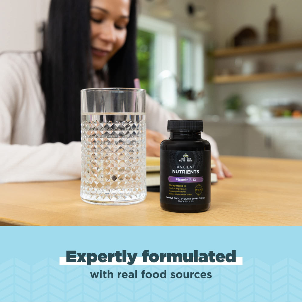 Daily routine with Ancient Nutrition B12 capsules and glass of water.
